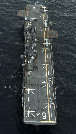 Illustration for article titled USS America: The Navy's Newest Flattop Can't Decide What The Hell It Is